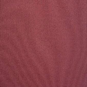 Burgundy herringbone fabric texture with a dense weave and matte finish, displaying subtle tonal variations in diagonal ridges.